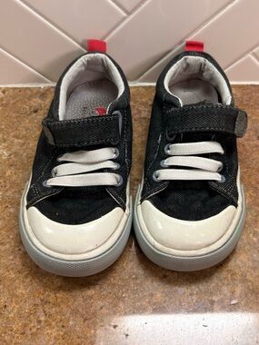 See Kai Run Black and White Kids Slip-On Sneakers with Red Heel Tab